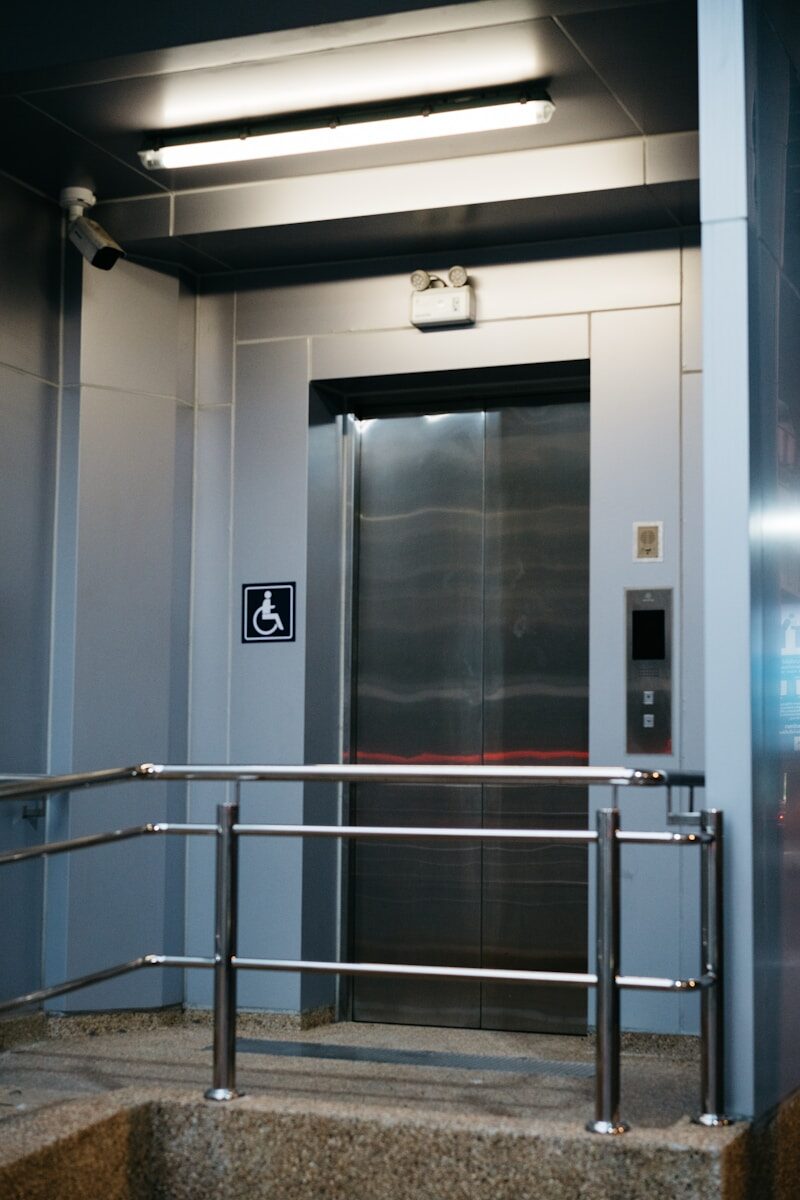 a metal hand rail in front of a door